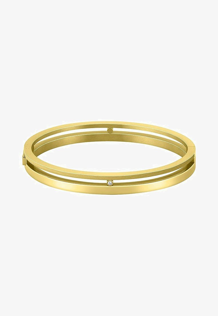 Pulsera de botín en tono dorado que presenta un diseño de doble banda con un acabado suave y un pequeño acento de diamante. Forma elegante y moderna.