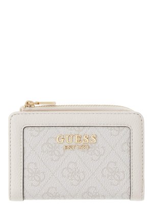 Petit portefeuille Guess couleur crème avec tissu texturé, fermeture éclair dorée et logo doré "GUESS EST 1981" sur le devant.