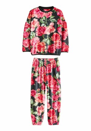 Floral loungewear set featuring a black background with large pink roses, a crew neck top, and elastic-waisted pants with cuffs.