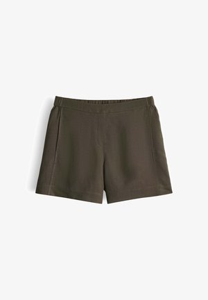 Shorts vert foncé à taille élastique avec coutures latérales et texture de tissu lisse, présentés à plat sur un fond blanc.