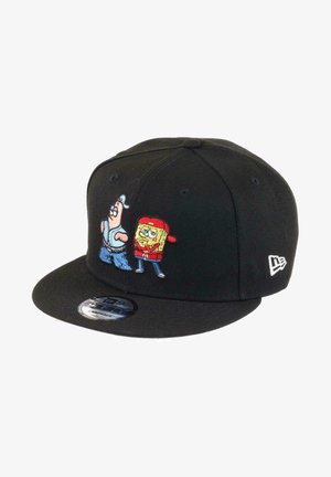 Black snapback cap featuring embroidered characters: a blue figure and a yellow square with a red hat, on the front panel.