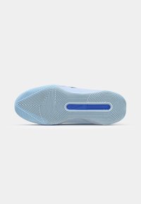 Nike sneaker sole in light blue rubber with textured zigzag pattern, featuring a central groove and a blue accent near the heel.