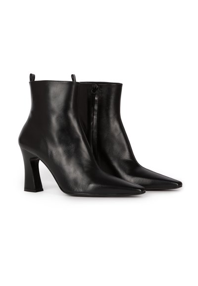 Black leather ankle boots with a sleek design, pointed toe, and 4-inch block heel. Features a side zipper and smooth texture.