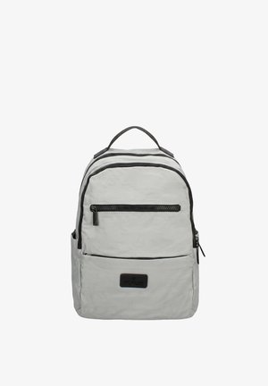Light gray backpack with black zippers, front zip pocket, side pockets, top handle, and a small black brand patch on the front pocket.