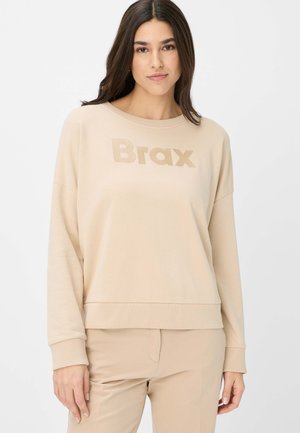 Beige sweatshirt featuring a crew neckline, dropped shoulders, and embossed "Brax" logo on the front. Soft fabric and ribbed cuffs.