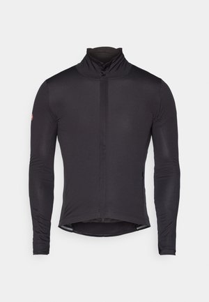 Maillot de cyclisme noir à manches longues avec col montant, fermeture éclair à l'avant et coupe ajustée. Tissu lisse sans motifs, présentant un logo subtil sur les épaules.