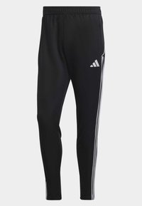 Black athletic pants made of smooth fabric, featuring an elastic waistband, tapered legs, and three vertical white stripes along the sides.