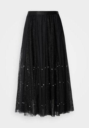 Black lace maxi skirt with a satin waistband, featuring a sheer layer embellished with silver sequins, and a textured pattern throughout.