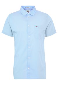 Ljusblå kortärmad skjorta i bomull med klassisk krage, knapplist fram, en bröstficka och logodetaljer.