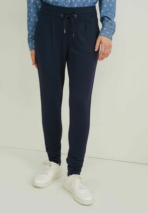 TAPERED FIT - Tracksuit bottoms - dark blue