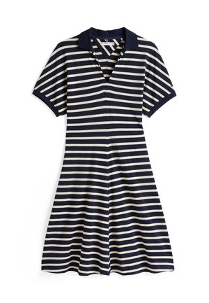 Jūras spēku un krēms svītrainā kleitā ar polo apkakli, īsām piedurknēm un izplešanos svārkiem. Izgatavota no mīksta, elastīga auduma, ar priekšējo rāvējslēdzēju.