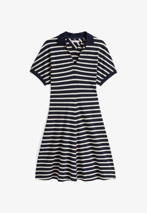 Haljina na modne prugice u mornarsko plavoj i krem boji s polo ovratnikom, kratkim rukavima i raširenim suknjom. Napravljena je od mekog, rastezljivog materijala i ima prednji zatvarač.