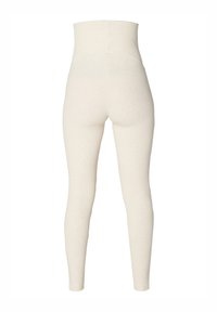 Höga leggings i krämfärgat stickat tyg, med en slät yta och en åtsittande design som går ner till anklarna utan synliga sömmar.