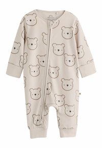 Beige ribbed baby romper with long sleeves and cuffs, featuring a zipper front and a repeated simple bear face pattern.