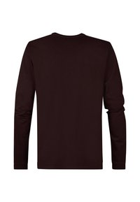 Koszulka z długim rękawem w ciemnym burgundzie. Wykonana z miękkiej bawełny, z okrągłym dekoltem i dopasowanymi rękawami. Brak widocznych grafik lub logo.