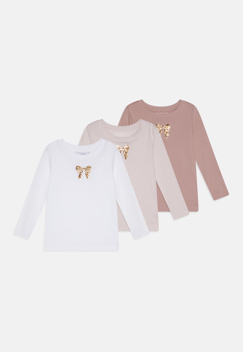 Trois chemises à manches longues en blanc, rose clair et rose foncé. Chacune présente un accent de nœud en sequins dorés sur la poitrine. Texture de tissu lisse.
