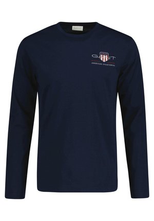 - Bluzka z długim rękawem