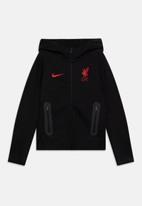 Zwarte zip-up jas met capuchon, rood Nike-logo en Liverpool FC-embleem. Voorzien van twee ritszakken aan de zijkant en een gestructureerde stof.