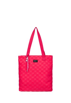Sac cabas à carreaux rose vif avec deux bretelles, une petite étiquette noire "ROXY" et un porte-clés décoratif tressé.
