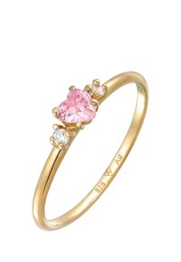 Arany gyűrű szív alakú rózsaszín drágakővel és két kis átlátszó kővel. Simább szalagját fényes felület jellemzi. 925 AG jelöléssel.