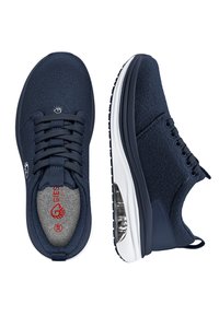 Navy blue sneakers with a textured upper, round laces, and a visible air cushion in the heel. Features a white sole and grey lining.