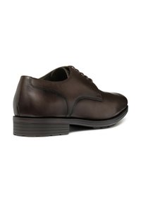Scarpe eleganti in pelle marrone con finitura liscia, punta rotonda e tacco basso impilato con suola in gomma testurizzata. Design classico con lacci.