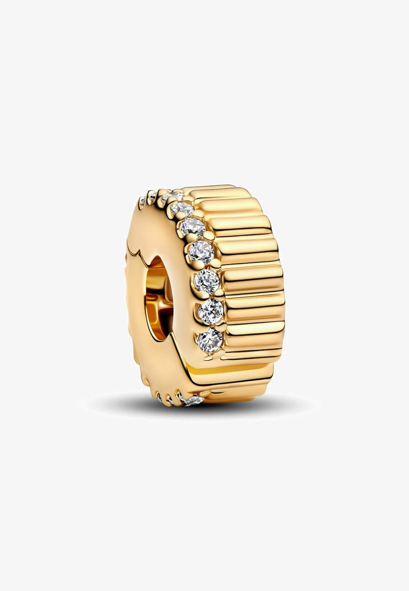 Zlatá perla s ribbovanou textúrou a radom šiestich čírých kryštálov po jednej strane. Obdĺžnikový tvar s centrálnym otvorom na navliekanie.