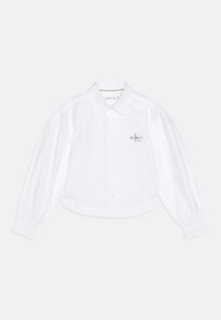 Camicia bianca cropped con bottone, colletto classico, maniche a palloncino e un piccolo logo Calvin Klein in viola chiaro sul lato sinistro del petto.