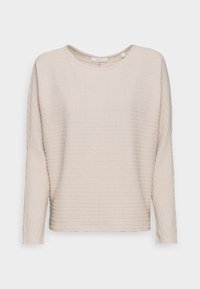 Haut beige à manches longues avec texture côtelée et col rond. Présente de subtils rayures horizontales et une coupe ample et décontractée.