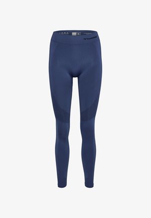 Navyblauwe leggings van ademend materiaal, met een gladde afwerking, hoge taille en getextureerde zijpanelen met een geometrisch patroon.