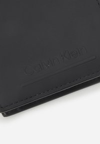 Calvin Klein BIFOLD UNISEX - Portafoglio - black