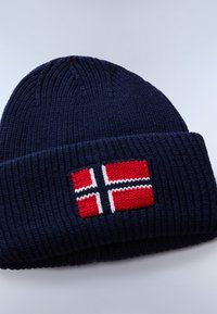 Navy blue knitted beanie with a thick ribbed texture featuring a Norwegian flag embroidered in red, white, and blue on the front.