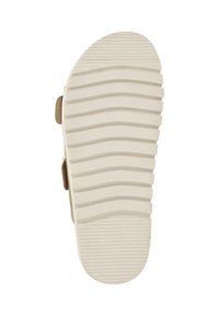 Zool van een schoen met een gestructureerd, geribbeld patroon, in een lichtbeige kleur en van een zacht, flexibel materiaal voor grip en comfort.