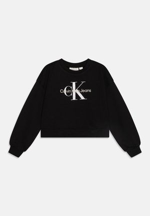 Felpa corta nera in cotone, con un grande logo silver "CK" e il testo bianco "Calvin Klein Jeans" sul davanti. Polsini e orlo a coste.