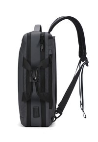 Sac à dos slim noir et gris avec plusieurs compartiments zippés, bandoulière rembourrée et poignées doubles sécurisées par un bouton-pression.