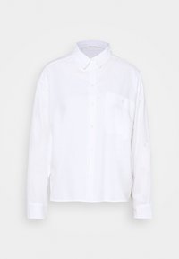 Chemise blanche à manches longues en tissu léger. Dotée d'un col boutonné, d'une poche avant et d'un ourlet droit. Texture lisse.