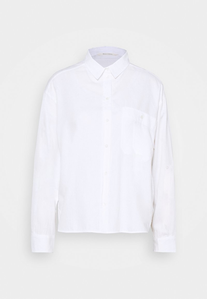 Chemise blanche à manches longues en tissu léger. Dotée d'un col boutonné, d'une poche avant et d'un ourlet droit. Texture lisse.