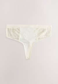 Kremo spalvos tamprės su nėrinių šonais. Minkšta medvilnės medžiaga, gėlių nėrinių detalės ir lygi juosmens juosta. Minimalistinis dizainas.