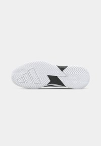 Shoe sole in black and white with a herringbone pattern, featuring a textured white rubber bottom and distinctive zigzag design elements.