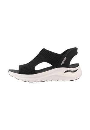 Sort mesh sandal med åben tå, hvid tyk sål og justerbar bagrem mærket Skechers Arch Fit til bueunderstøttelse.