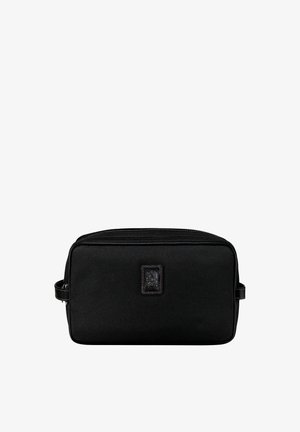 Black toiletry bag made of durable fabric, featuring a rectangular shape, top zipper closure, side handle, and embossed logo detail.