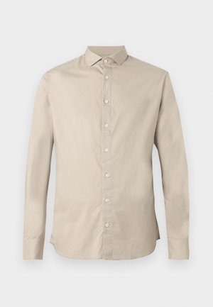 Beige langermet skjorte med knapper, spiss krage, seks frontknapper og tilpasset passform.