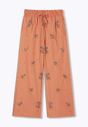 Pantalon ample à rayures verticales orange et blanc, avec une taille élastique, un cordon de serrage et des motifs floraux brodés dispersés.
