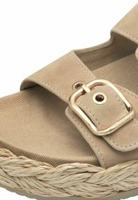Beige suede sandal with a gold-tone buckle, featuring a woven jute platform, textured insole, and smooth stitching along the edges.