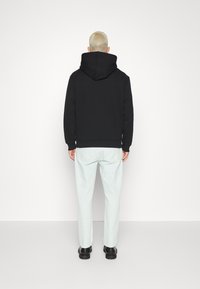 Filippa K Kapuzenpullover - black
