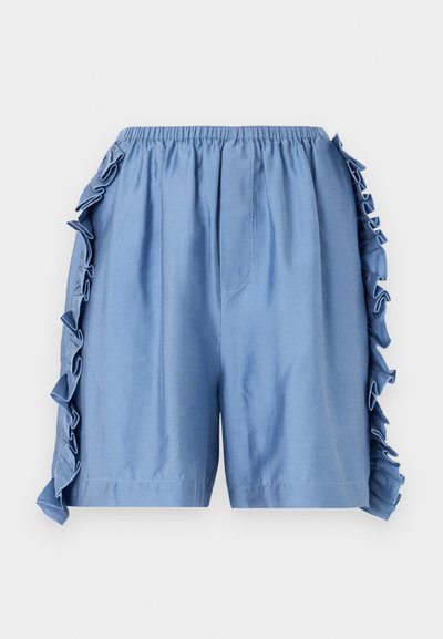Svetlomodré bavlnené šortky s elastickým pásom, zdobené volánikmi pozdĺž bočných švov a so voľným strihom.