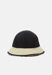 Cappello a secchiello nero e beige con parte superiore strutturata, ampia visiera e una fascia in nero con il testo "THE NORTH FACE".
