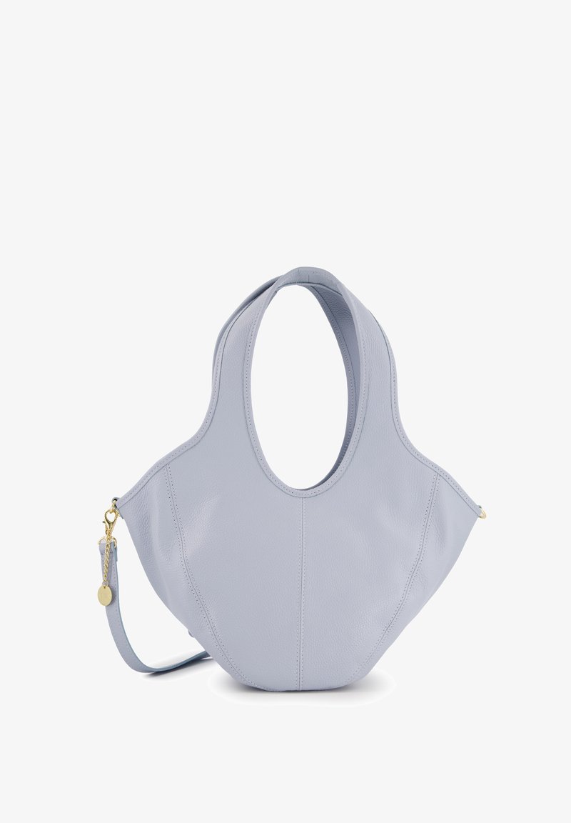 Light blue leather handbag with a unique shape, featuring a wide top handle and an adjustable strap, smooth texture, and side zipper.