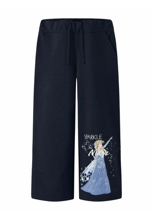 Tmavomodré nohavice s širokými nohavicami, sťahované v páse šnúrkou, s grafickým motívom ženy v trblietavých modrých šatách na spodnej časti nohavice a textom "Iskri ako kúzlo."