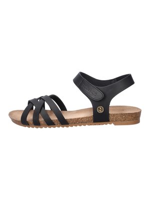 Black flat sandal with three front straps, ankle strap with Velcro closure, cork footbed, and rubber sole.